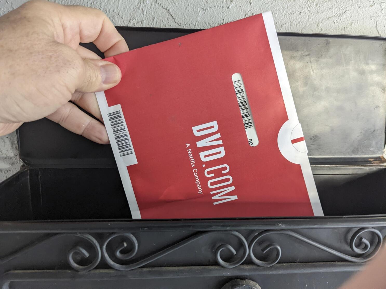 Netflix is ending its DVD-by-mail service | AP News